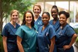 © Anne Schaum - A group of nurses in a team photo. Professional healthcare services.
