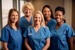 © Anne Schaum - group of smiling doctors or nurses at hospital or medical clinic looking at camera