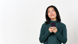 © Sino Images Studio - Holding Smartphone Smiling and looking up Of Beautiful Asian Woman Isolated On White Background
