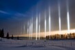 Vertical light beams called light pillars in Canada. Generative AI