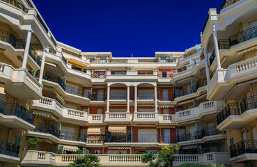 Poster - Colorful Mediterranean waterfront house facade in Menton, French Riviera, South of France on a sunny day