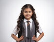 © StockImageFactory - Cute little Indian schoolgirl in uniform looking at camera with backpack while standing