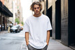 © Cadengo - blonde man wearing an oversized blank white crew neck tshirt.