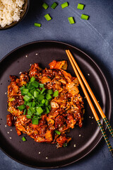 Wall Mural - Fried kimchi with pork onions and spices. Traditional Korean food