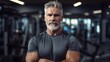 © standret - Mature fitness coach in the gym. Beautiful illustration picture. Generative AI