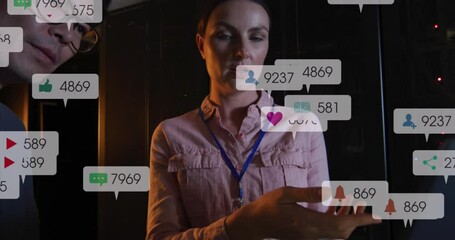 Poster - Animation of notification bars over diverse coworkers discussing on laptop in server room