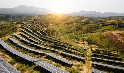 Aerial photography of solar photovoltaic cells built on a hillside