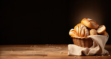 Bread In Basket On Black Background. Various Kinds Of Bread In Basket On A Black Background.copy Space.copy Text.for Advertising Design.landscape.
