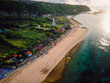 Pandawa beach with scenic landscape, lighthouse and ocean in Bali.