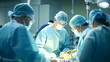 © BlazingDesigns - Team of Surgeons, male and female surgeons operating on patient in operating at hospital.