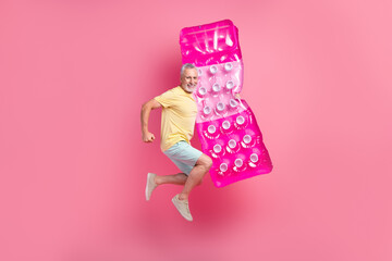 Poster - Full size body photo of jumping running hurry swimming ocean pensioner man hold air inflatable mattress isolated on pink color background