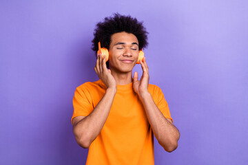 Poster - Photo portrait of relax time guy youngster enjoy his wireless headphones spotify phonk playlist isolated on violet color background