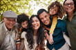© Talia Mdlungu/peopleimages.com - Nature park, portrait and big family smile for outdoor wellness, bonding and connect on Mexican vacation. Forest, face and relax children, parents and grandparents happy for love, garden and support