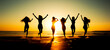 © toodlingstudio - Silhouette of group of friends are having fun, having fun on the beach in the evening sunset.