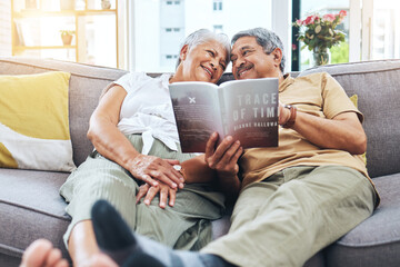 Canvas Print - Senior, relax and a couple reading a book on the sofa for learning together. Smile, love and an elderly man and woman with a novel or story on a home living room couch for knowledge in retirement