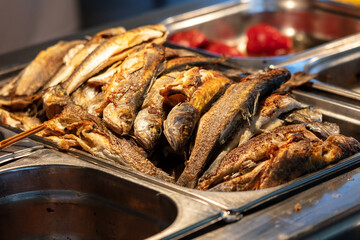 Poster - Fried fish on a tray in a restaurant