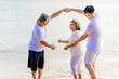 © lukyeee_nuttawut - Happy asian family, senior retired couple and young man smiling and  enjoying at sea beach in retired vacation. Health care, Family outdoor lifestyle