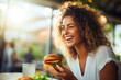 Restaurant Indulgence: Woman Relishing Burger