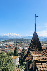 Wall Mural - View of Lucerne rooftops, Lake Lucerne (Lake of the four forested settlements) and the Alps in the background