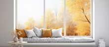 Scandinavian Interior Design With A Stylish White Room Sofa And Autumn Landscape Seen Through The Window In