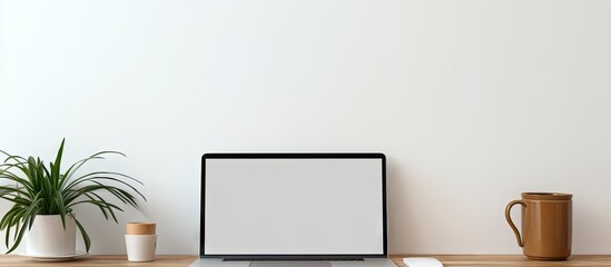 Poster - Blank screen on white table with mouse and smartphone in home or office setting