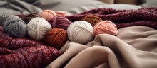 Yarn Balls And A Wool Blanket On The Bedspread