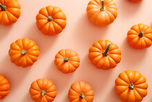 Small Orange Pumpkins On Pastel Background