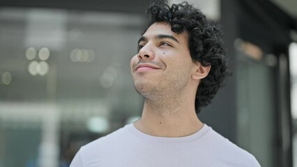 Poster - Young latin man smiling confident standing at street