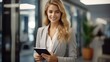 © visoot - beautiful Successful business woman looking confident and smiling at office and and using her digital tablet.