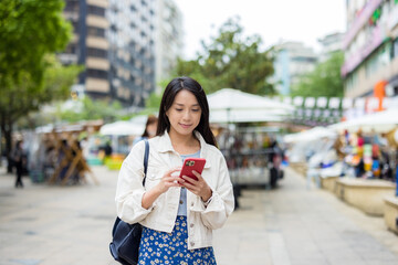 Poster - Woman use of mobile phone in city of Taipei