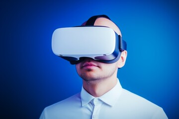 Wall Mural - European man guy use computer technology person wear VR headset virtual reality goggles exploration metaverse modern advanced tech future progress plays cyber game experience abstract background