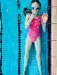 © Анна Молько - a girl in a pink swimsuit and swimming goggles in a pool under water