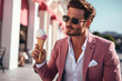 Handsome man indulging in the pure delight of an ice cream cone. His expression radiates joy and satisfaction. Ai generated