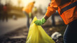 © Bela - Close-up of a young volunteer, emphasizing global pollution concerns while cleaning up trash.