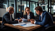 © Sasint - Group of three financial professional discussing numbers in a business meeting. Team of business people brainstorming solutions for a project as they work towards the success of their company.