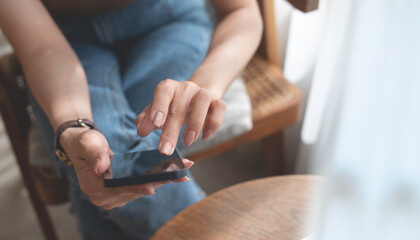 Canvas Print - Close up of woman hand holding, using mobile phone for online shopping, digital payment via mobile banking app, social media, internet network, business and technology, people lifestyle