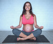 © georgerudy - Pregnant woman doing yoga