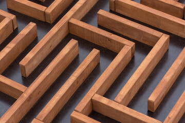 brown wooden maze on dark dirty background