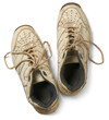 pair of old used shoes isolated white background, dirty sport shoes or sneakers with tied lace taken straight from above