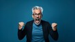© Jorge Ferreiro - hispanic man with gray hair excited yelling