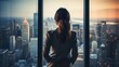 © Jorge Ferreiro - businesswoman at the office window contemplating the city