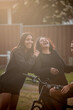 © Austockphoto - Aboriginal family in backyard mother and daughter laughing