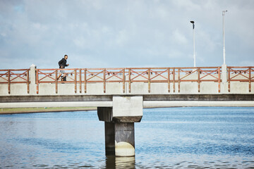 Sticker - Exercise, sky and a man running on a bridge for a cardio or endurance workout on cloud mockup space. Fitness, sports and training for a marathon with a male runner or athlete outdoor for a challenge