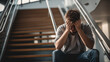 © MP Studio - Young guy student sitting on the stairs depressed.