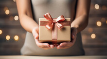 Woman Holding A Wrapped Gift