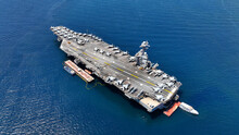 Aerial Drone Photo Of Latest Technology American Flag Nuclear Aircraft Carrier Anchored In Deep Blue Sea