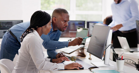 Wall Mural - African Business Team Working On Computer