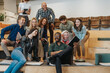 © qunica.com - Multiracial group of businesspeople taking a selfie at modern co working space before brainstorming