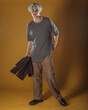 © qunica.com - Portrait of a smart young man standing against yellow backgroun