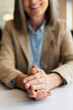 © Maria Vitkovska - Closeup of smiling businesswoman hands applauds sitting in modern office